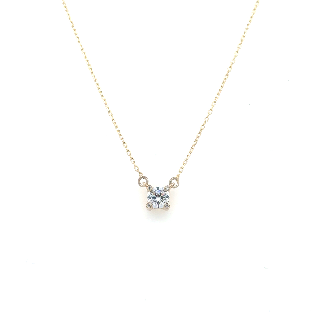 Collier solitaire, or jaune 10 carats, zircon incolore