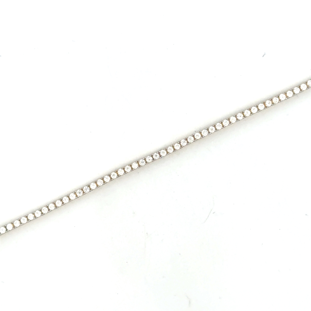 Bracelet tennis, or jaune 10 carats, zircons incolores