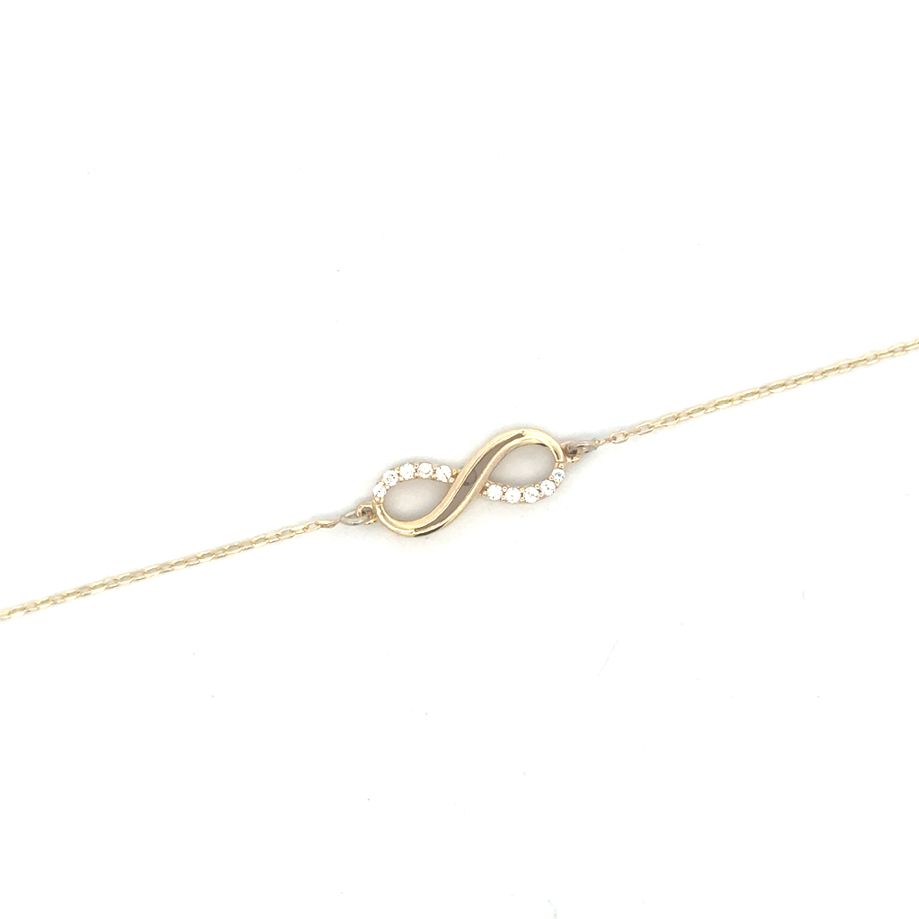 Bracelet symbole de l'infini, or jaune 10 carats, zircons incolores Bracelet symbole de l'infini, or jaune 10 carats, zircons incolores