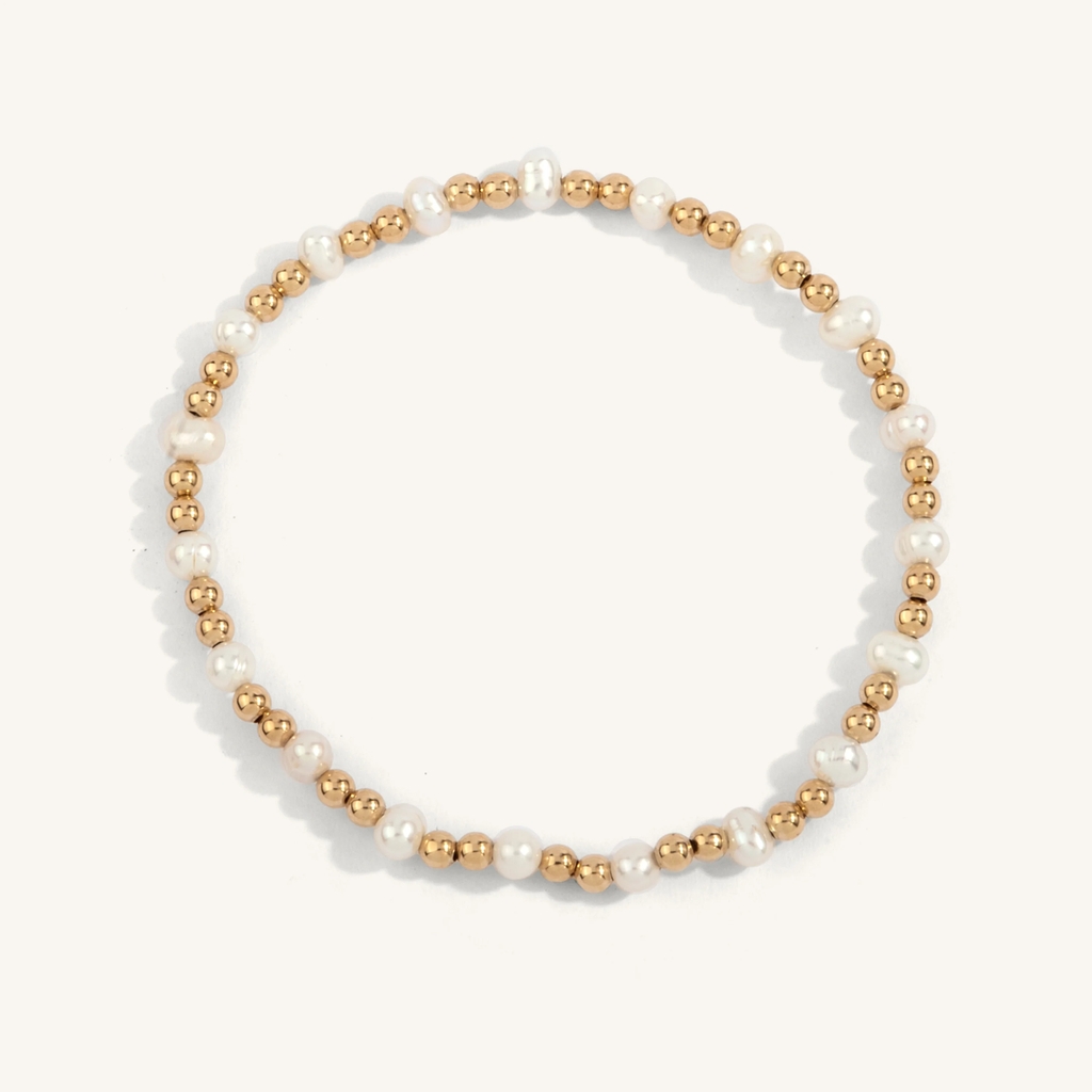 Bracelet extensible, métal doublé d'or 14 carats, perles, 4 millimètres Bracelet extensible, métal doublé d'or 14 carats, perles, 4 millimètres